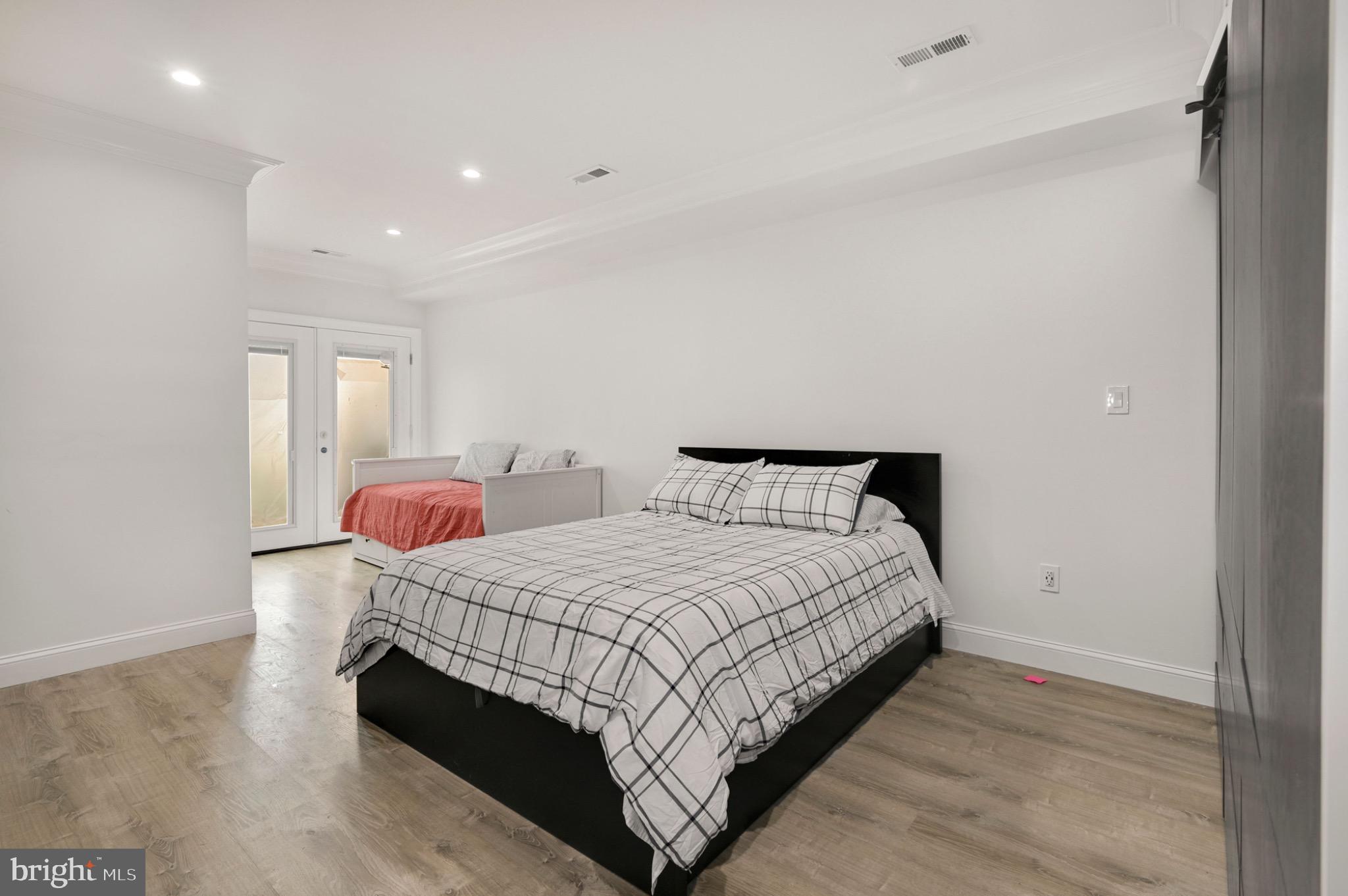 729 Kenyon Street Northwest Washington, DC 20010 - Photo 7 of 26 Modern bedroom with natural light.(Unit B)