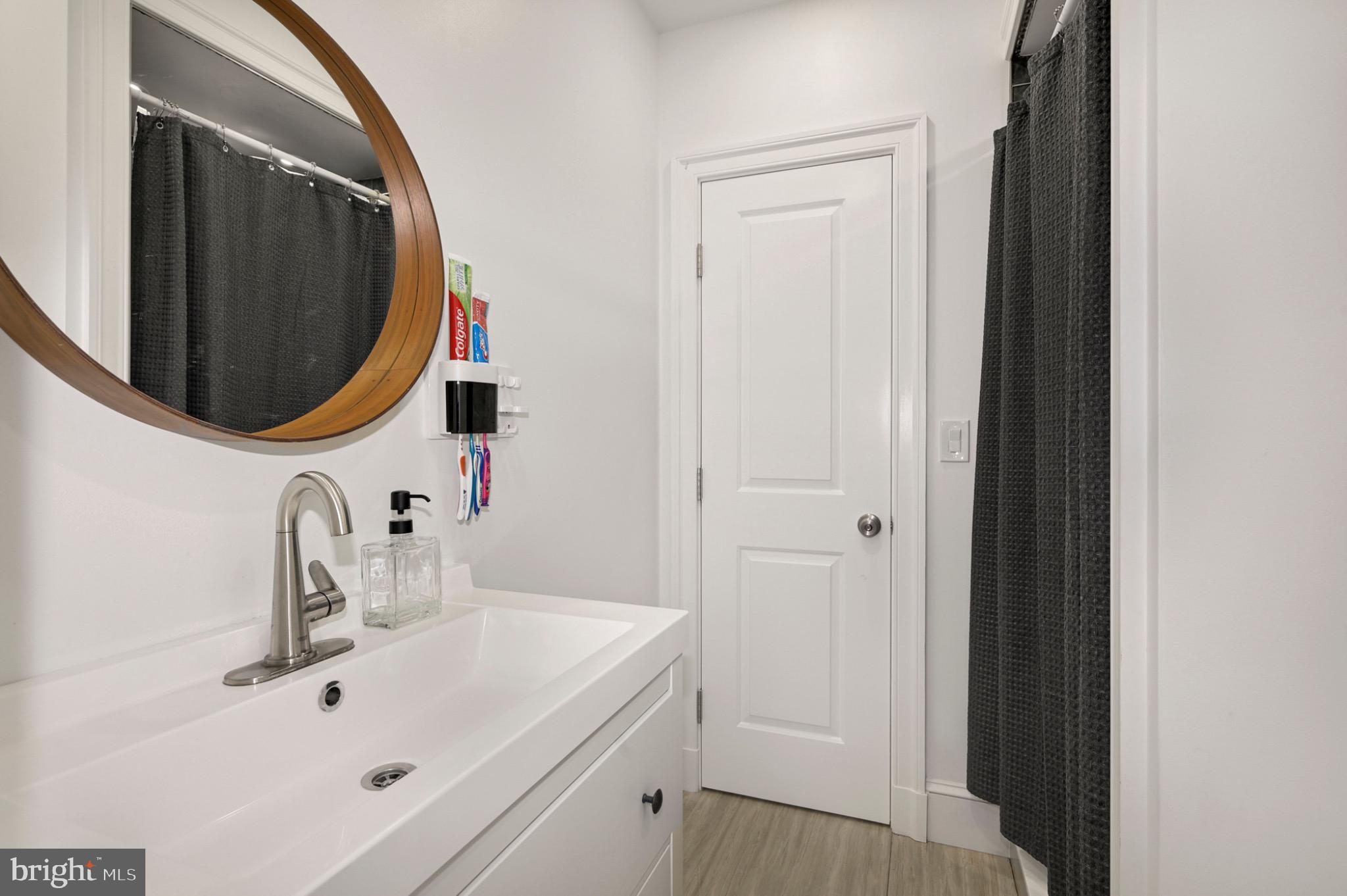 729 Kenyon Street Northwest Washington, DC 20010 - Photo 10 of 26 Sleek modern bathroom with stylish accents.