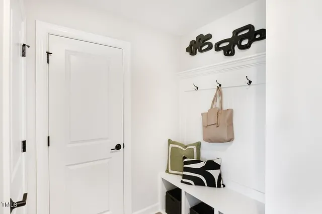a spacious bathroom with double vanity a mirror and a shower