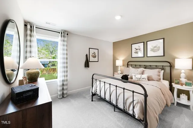 a bathroom with a double vanity sink a toilet and shower