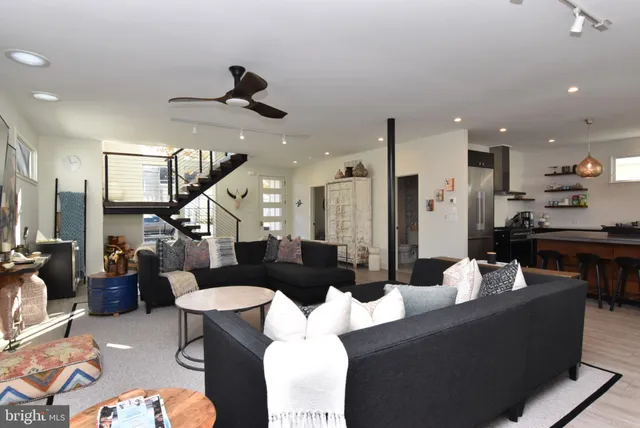 a large kitchen with a table and chairs