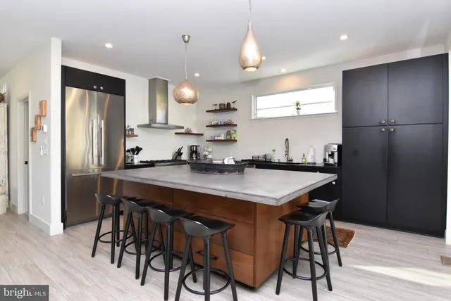 a living room with fireplace furniture and a flat screen tv
