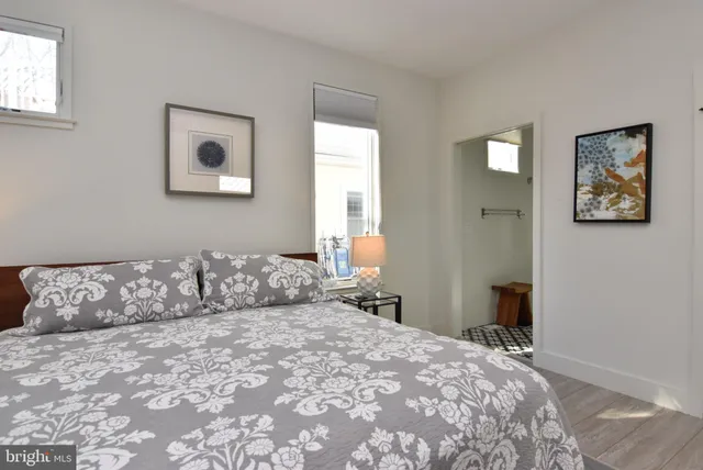 a bathroom with a sink a toilet a shower and a mirror