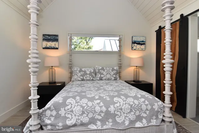 a spacious bathroom with a double vanity sink mirror and a bathtub