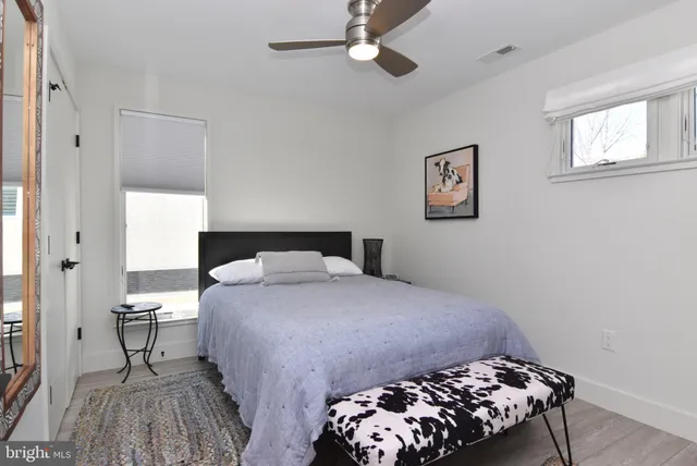 a bedroom with a bed and a table in it