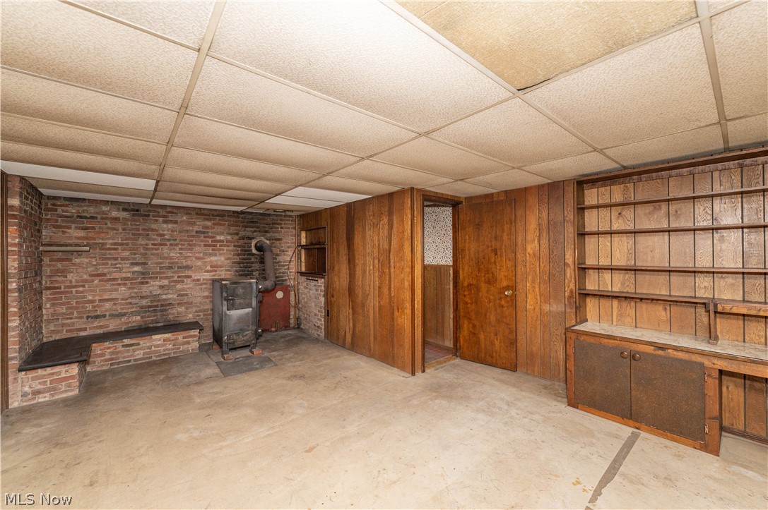 12310 Huntoon Road Painesville, OH 44077 - Photo 31 of 48 Huge family room with wood burning stove and built-in shelving