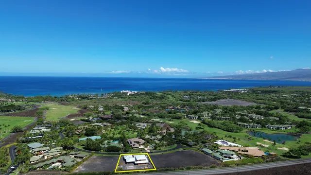 an aerial view of a house with outdoor space