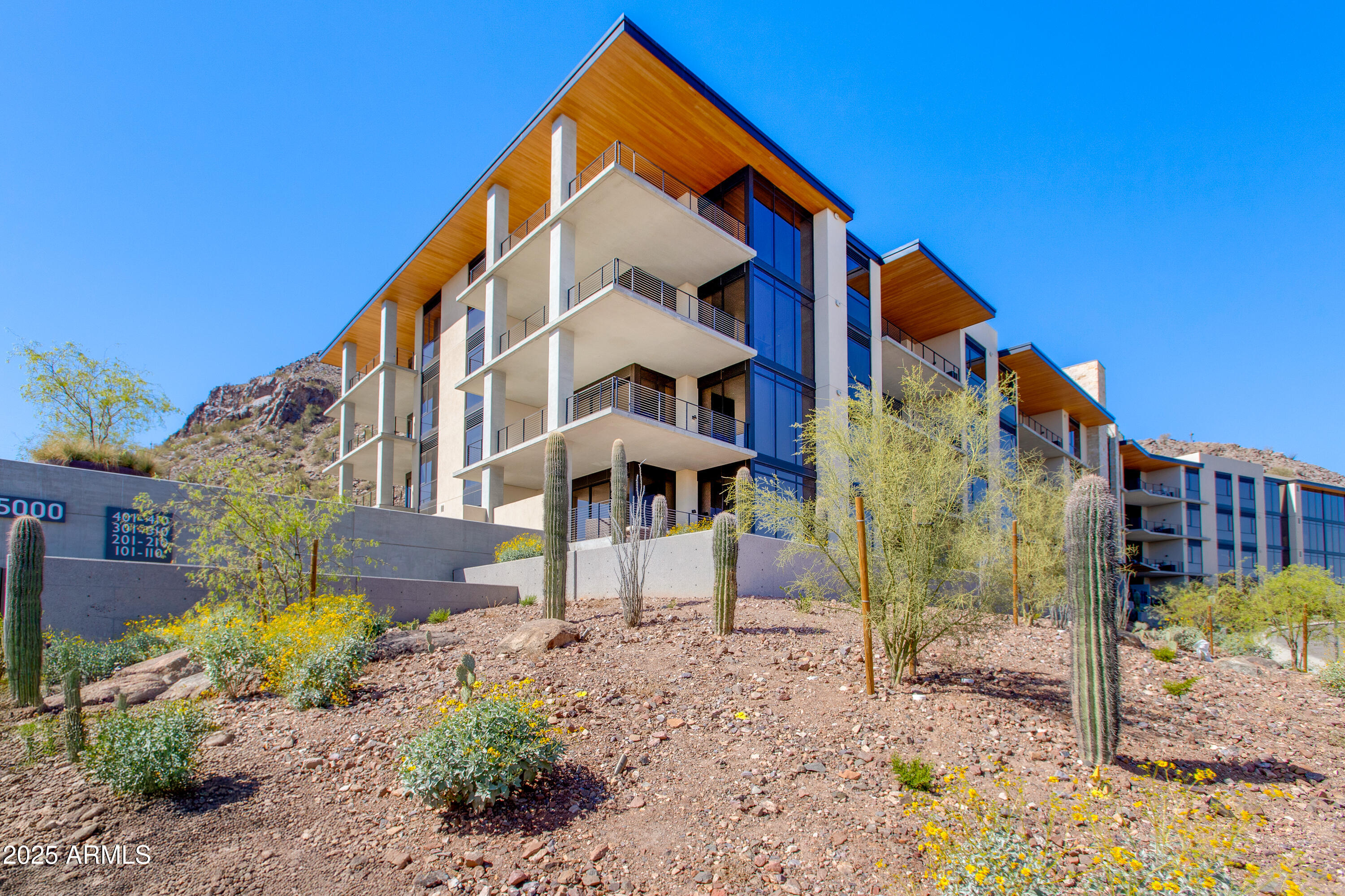 5000 North Camelback Ridge Drive, Unit 206 Scottsdale, AZ 85251 - Photo 5 of 62 a view of a house with a yard