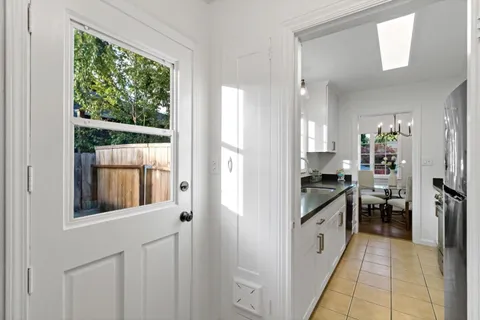 a kitchen with a stove a refrigerator and a sink