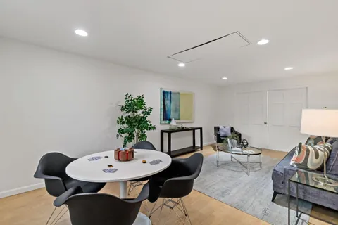 a view of a livingroom with furniture and a table