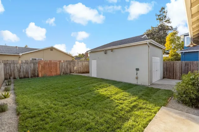 a view of a backyard of the house