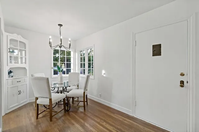 a workspace room with furniture and window