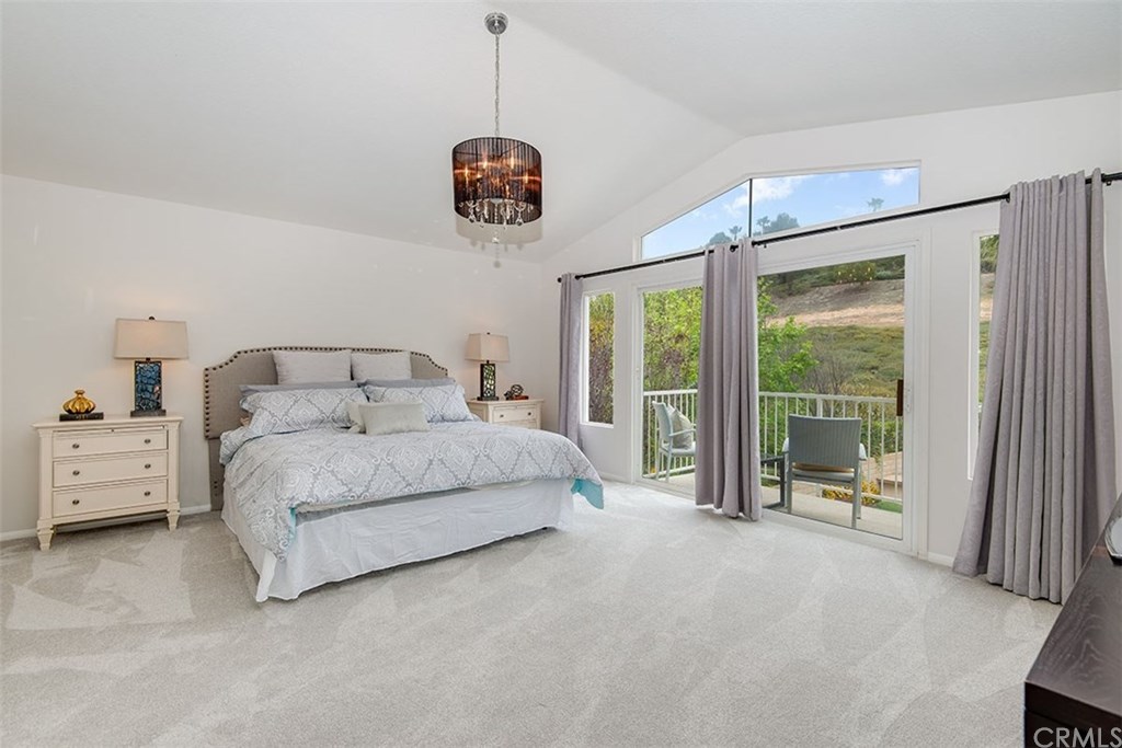27952 Rural Lane Laguna Niguel, CA 92677 - Photo 12 of 28 a spacious bedroom with a bed and a large window