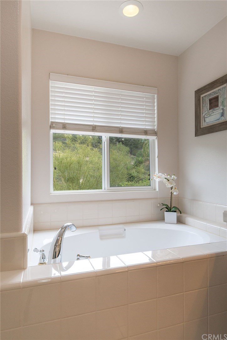 27952 Rural Lane Laguna Niguel, CA 92677 - Photo 15 of 28 a bathroom with a granite countertop sink and bathtub