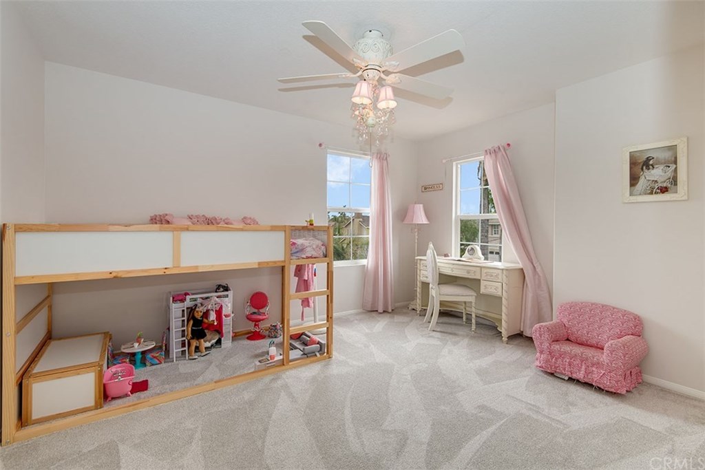 27952 Rural Lane Laguna Niguel, CA 92677 - Photo 17 of 28 a bedroom with furniture and a chandelier