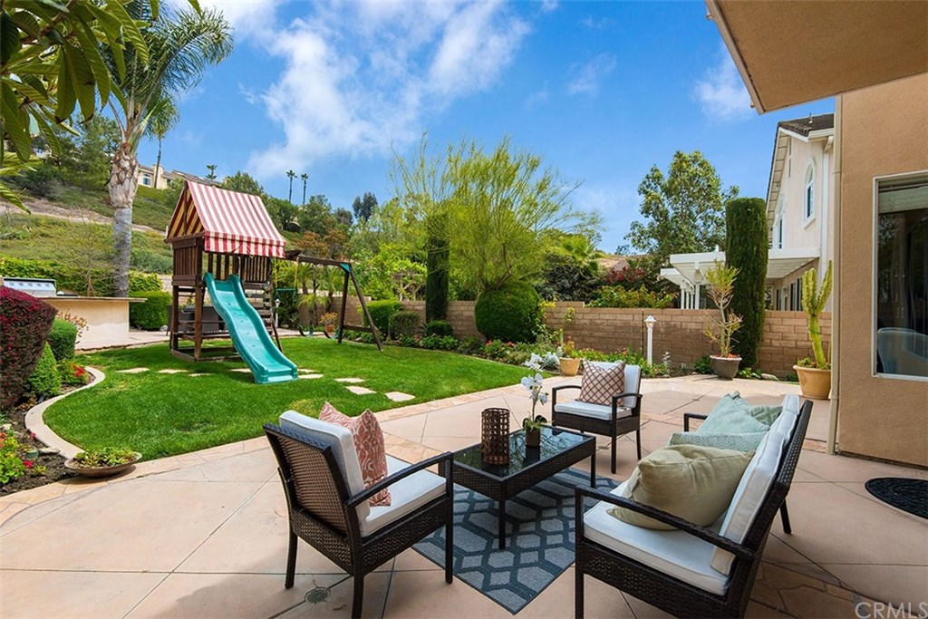 27952 Rural Lane Laguna Niguel, CA 92677 - Photo 20 of 28 a view of a house with backyard sitting area and garden