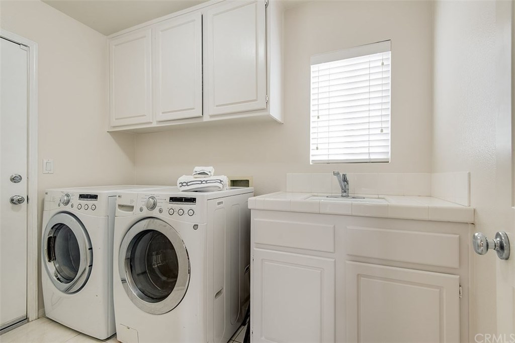 27952 Rural Lane Laguna Niguel, CA 92677 - Photo 23 of 28 a utility room with sink dryer and washer