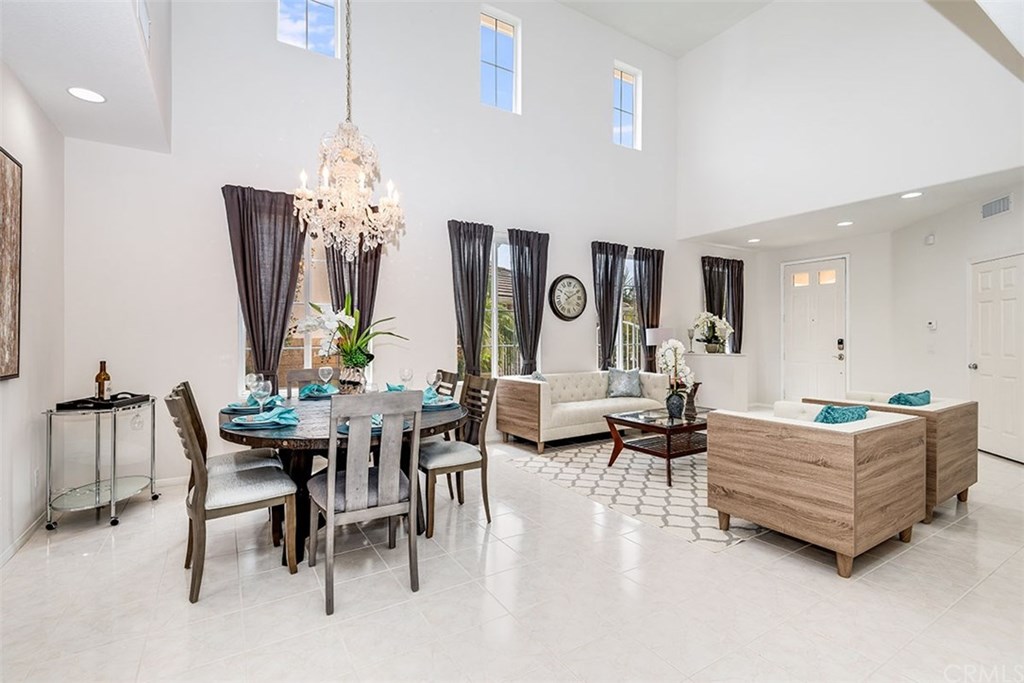 27952 Rural Lane Laguna Niguel, CA 92677 - Photo 3 of 28 a living room with fireplace furniture and a chandelier