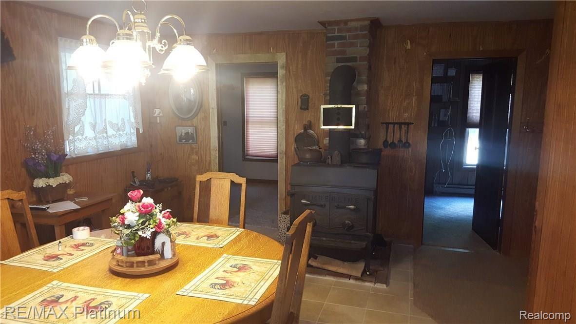 10803 South Brinton Road Edmore, MI 48829 - Photo 14 of 36 Dining Room w/woodstove