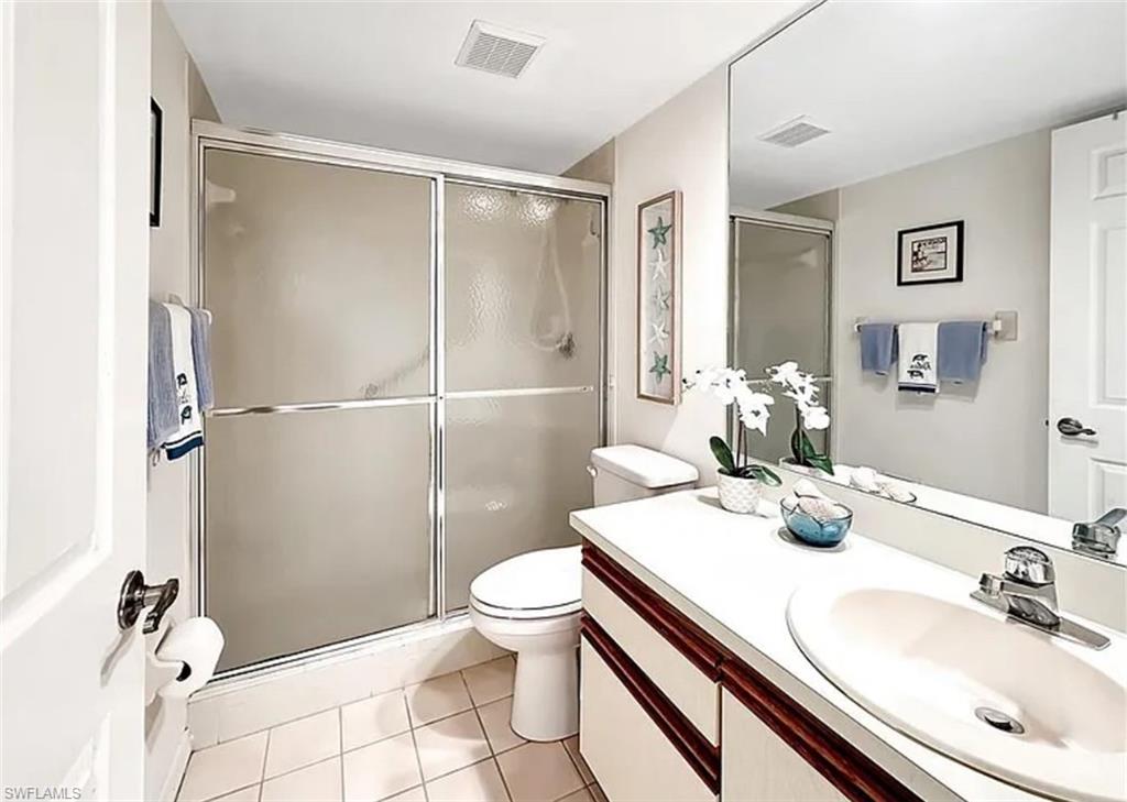 905 Augusta Boulevard Naples, FL 34113 - Photo 15 of 20 a bathroom with a sink toilet and shower
