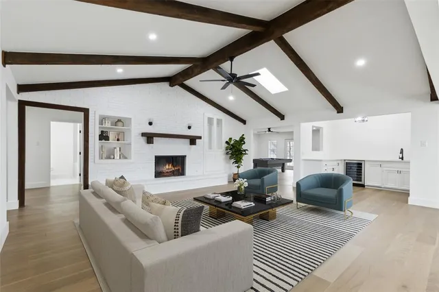 a living room with furniture fireplace and a flat screen tv