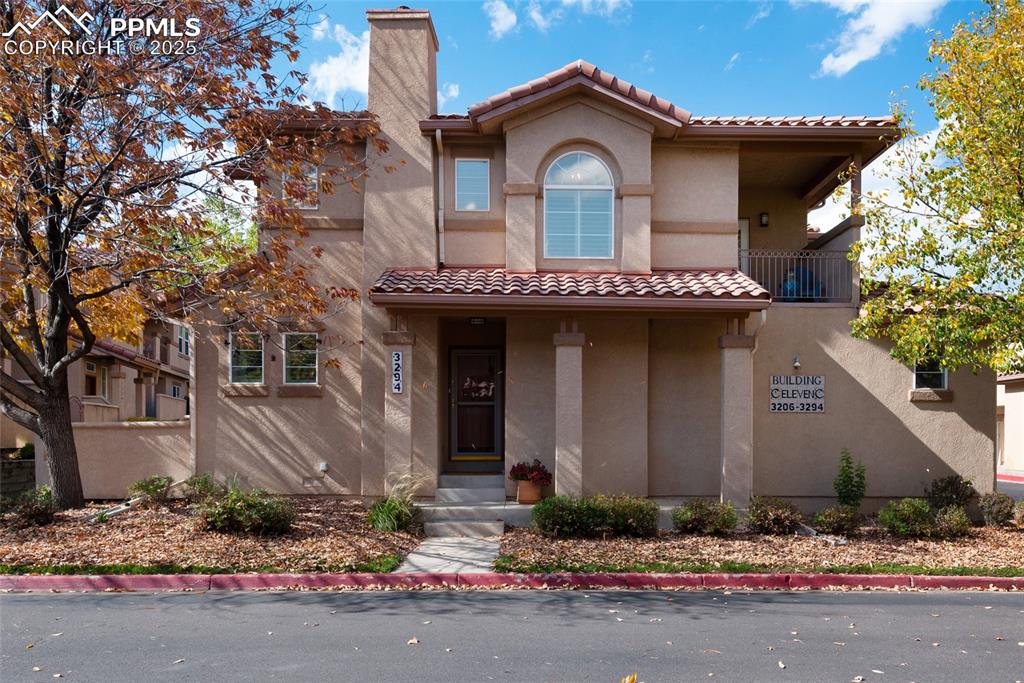 3294 Apogee View Colorado Springs, CO 80906 - Photo 1 of 35 a front view of a house with a yard and garage