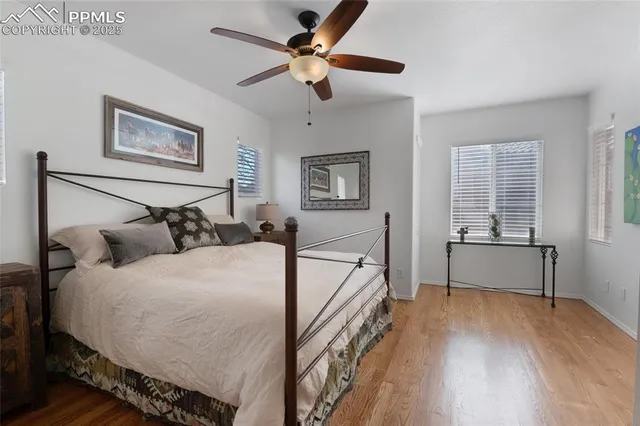 a bedroom with bed and a window