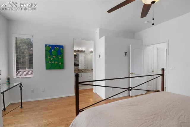 a bathroom with a granite countertop bathtub a sink and mirror