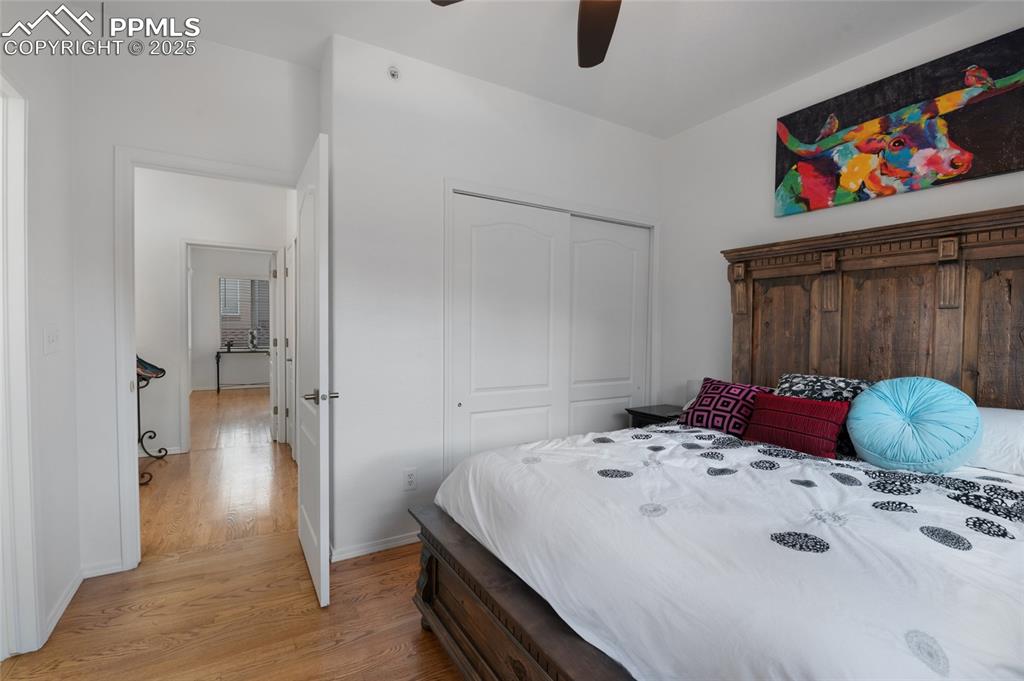 3294 Apogee View Colorado Springs, CO 80906 - Photo 18 of 35 a bedroom with a bed and a cabinet