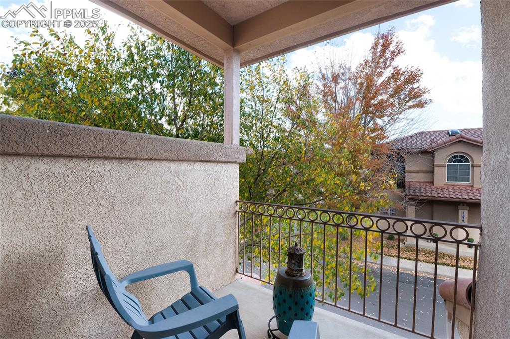 3294 Apogee View Colorado Springs, CO 80906 - Photo 20 of 35 a view of a chair and table in the balcony