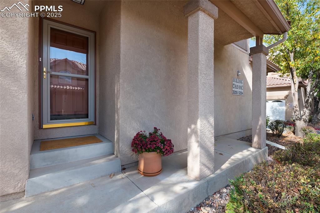 3294 Apogee View Colorado Springs, CO 80906 - Photo 2 of 35 a room with a potted plant and outdoor seating