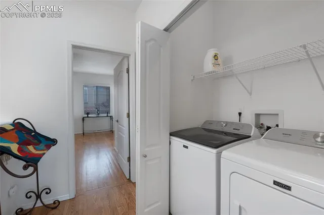 a balcony with table and chairs