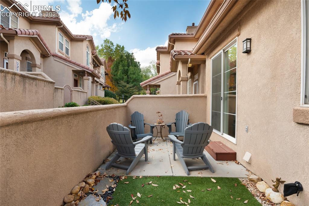 3294 Apogee View Colorado Springs, CO 80906 - Photo 23 of 35 a balcony with table and chairs