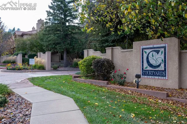 a sign that is in front of flowers