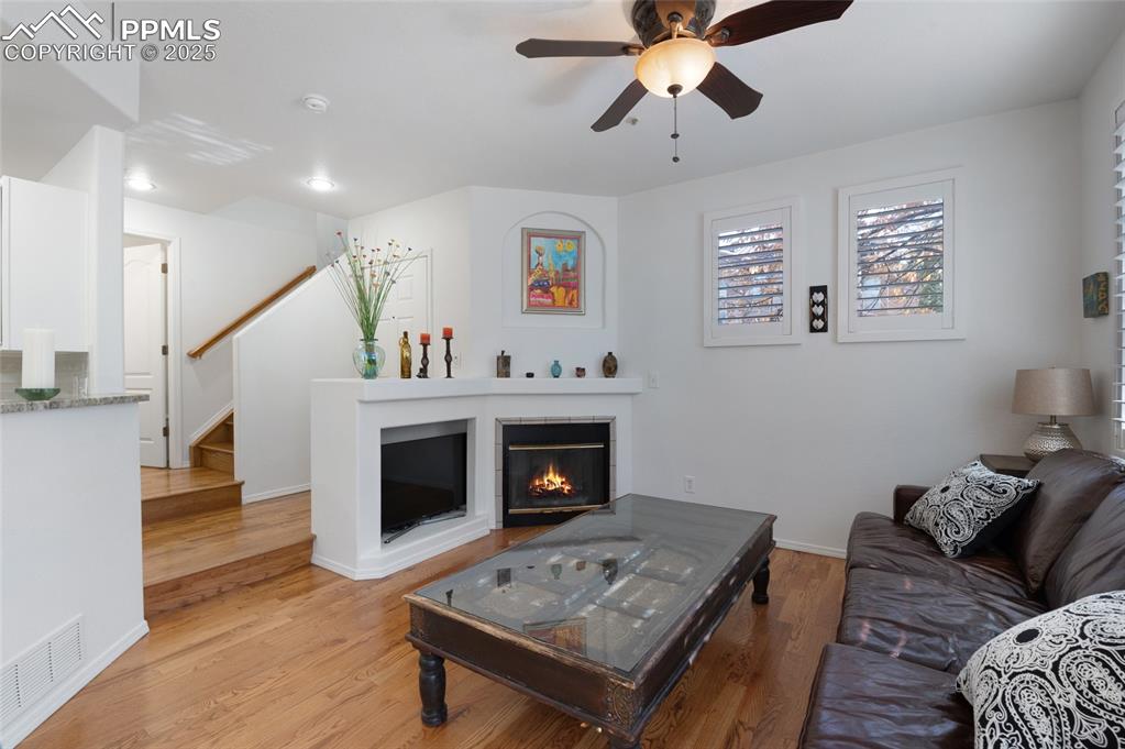 3294 Apogee View Colorado Springs, CO 80906 - Photo 7 of 35 a living room with furniture and a fireplace