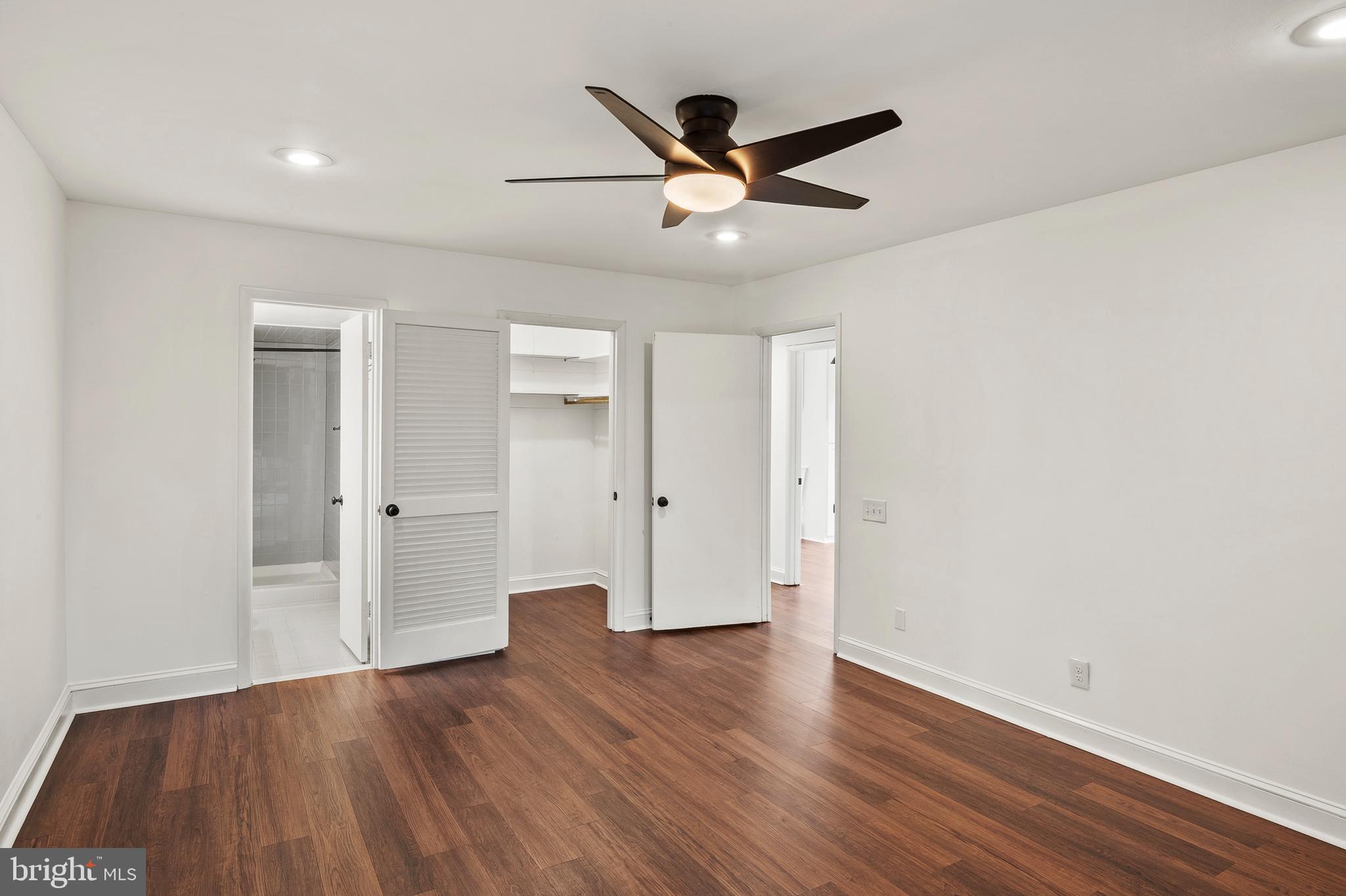 755 Fairview Avenue, Unit 755D Annapolis, MD 21403 - Photo 12 of 44 an empty room with wooden floor and windows