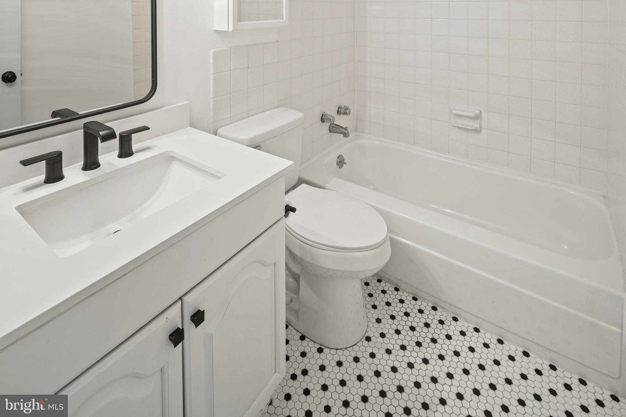755 Fairview Avenue, Unit 755D Annapolis, MD 21403 - Photo 20 of 44 a bathroom with a sink a toilet and shower