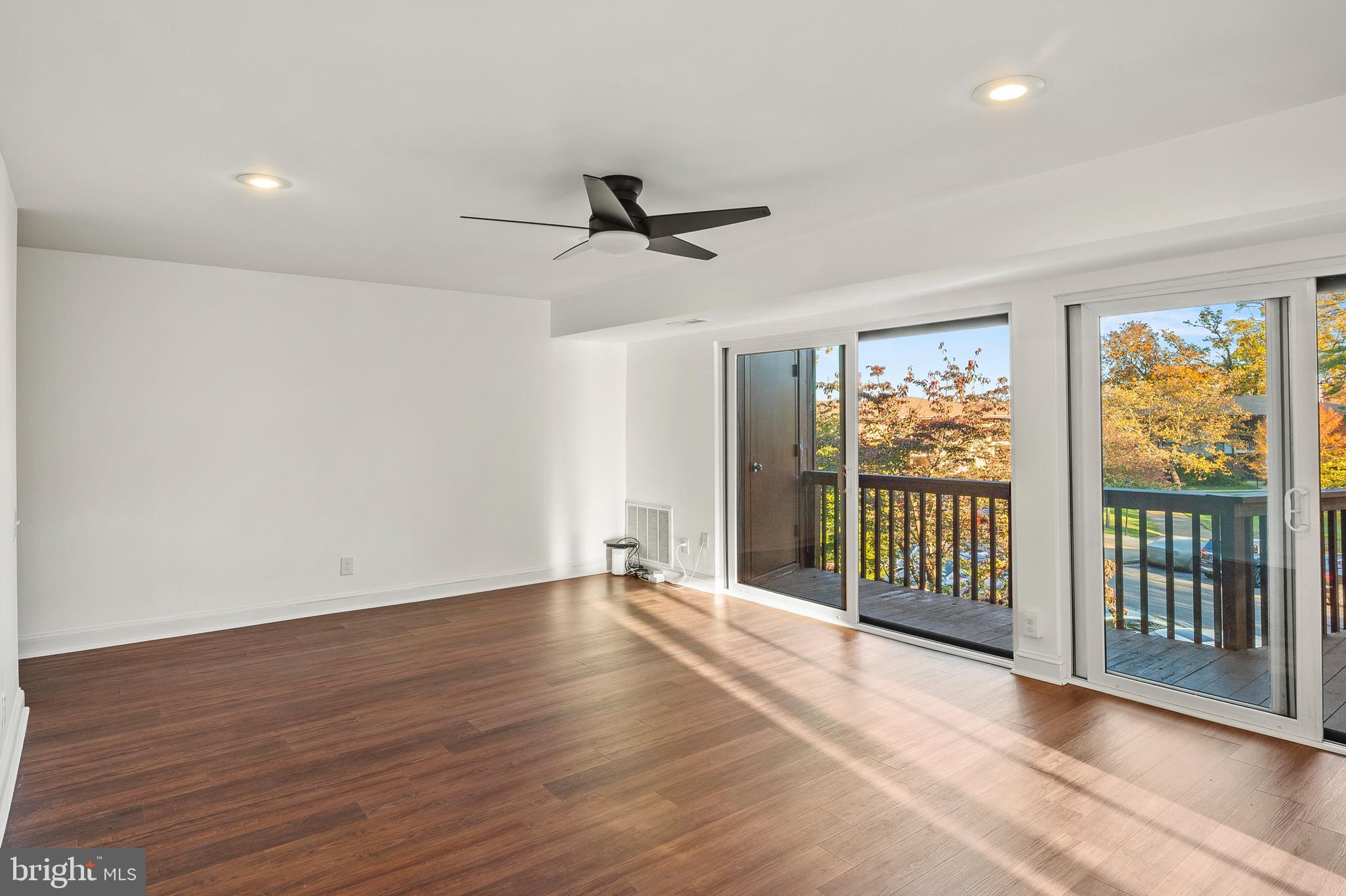 755 Fairview Avenue, Unit 755D Annapolis, MD 21403 - Photo 10 of 44 a view of a room with wooden floor and windows