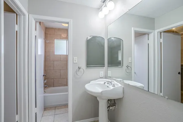 a bathroom with a sink and a mirror
