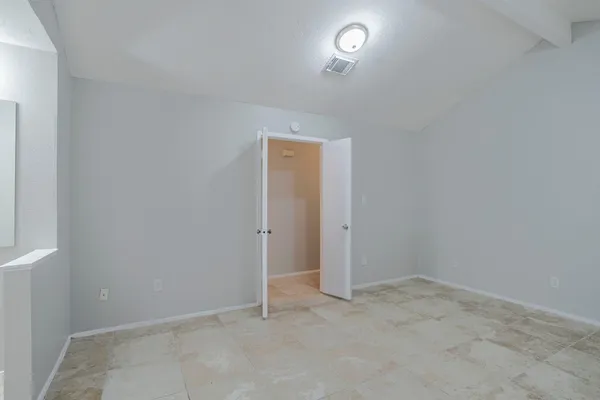 an empty room with a empty space and a window