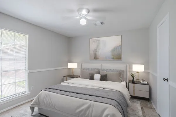 a bedroom with a bed and a window