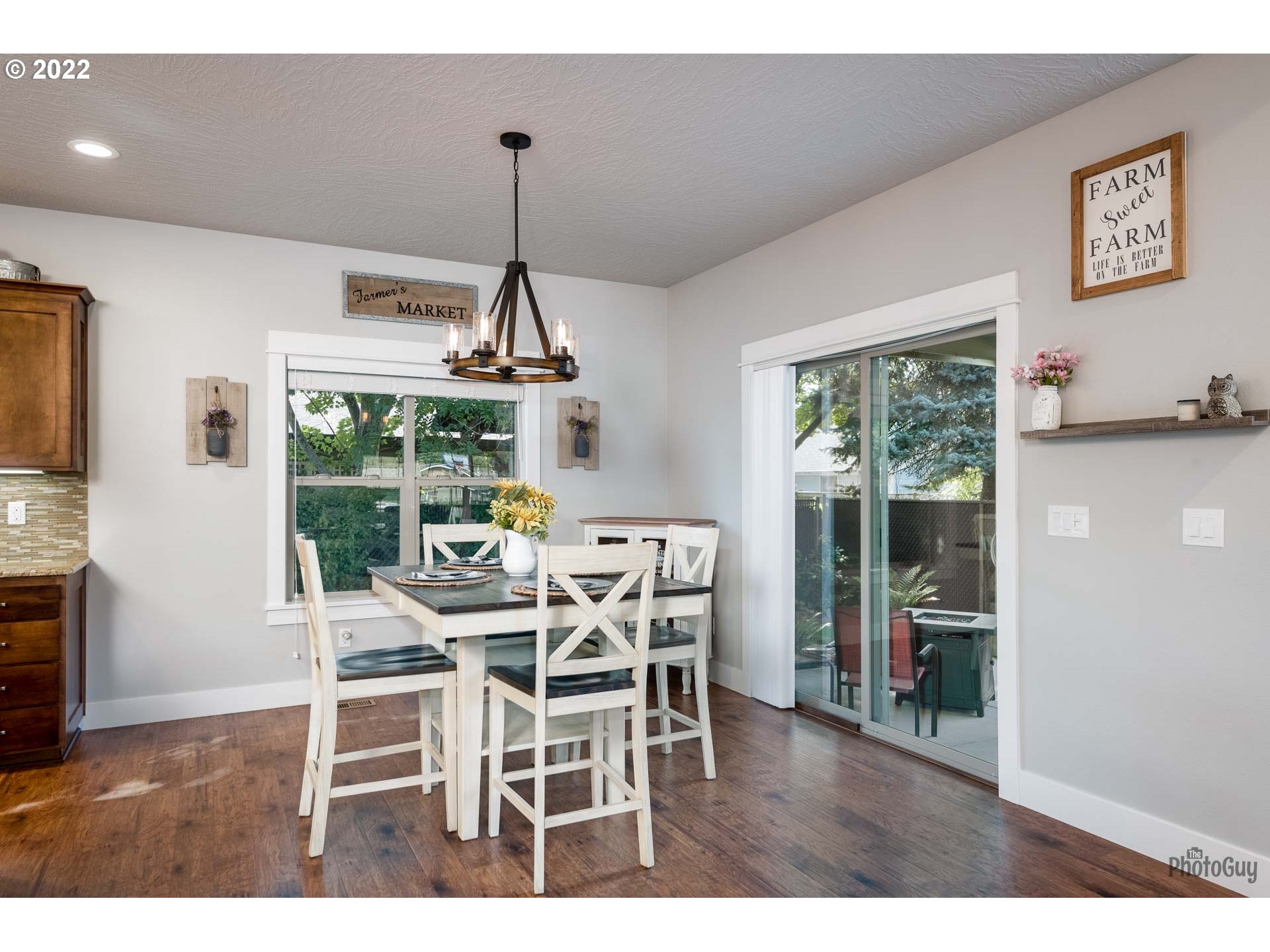 853 67th Place Springfield, OR 97478 - Photo 13 of 32 a dining room with furniture window wooden floor