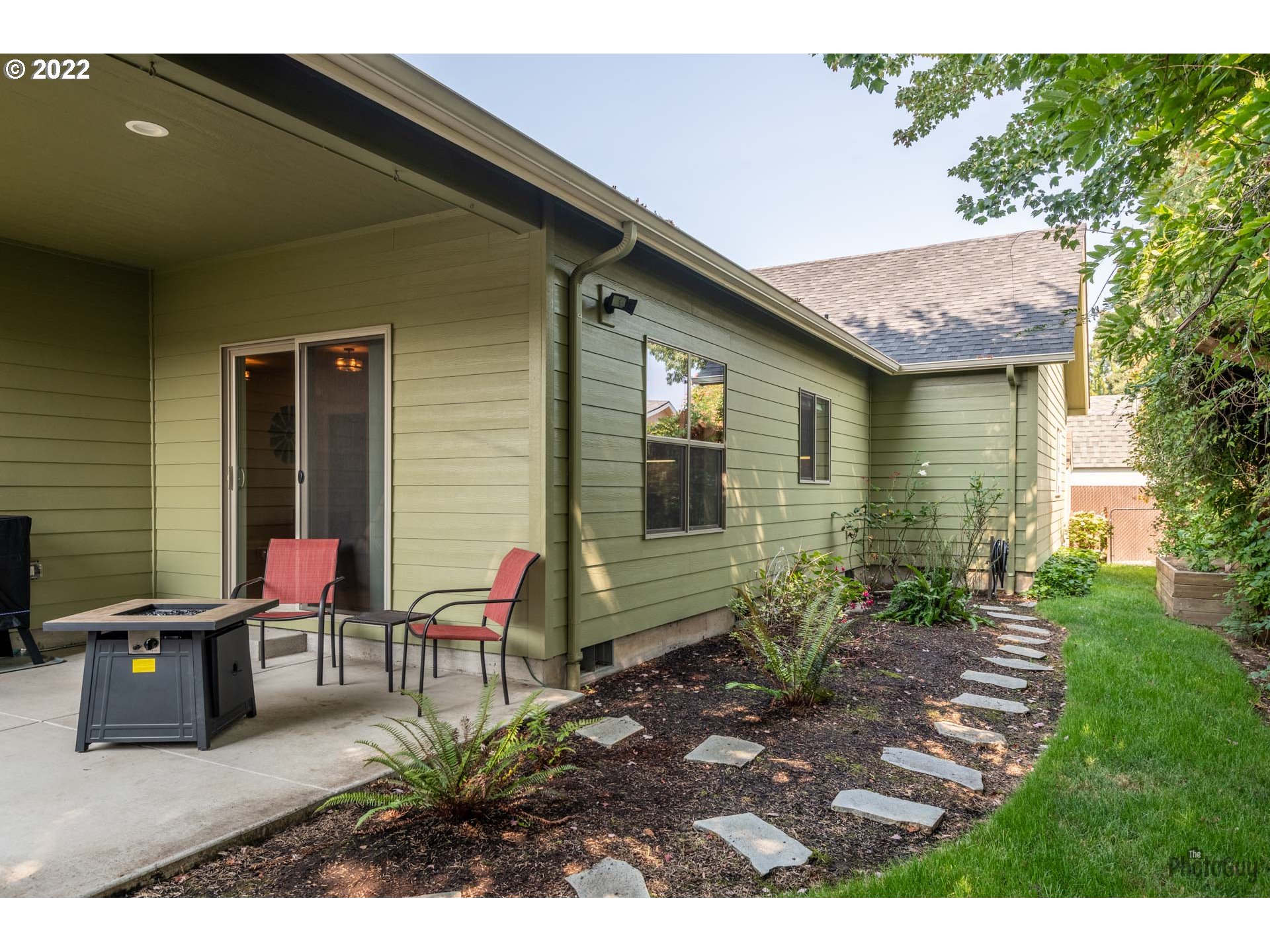 853 67th Place Springfield, OR 97478 - Photo 29 of 32 a backyard of a house with outdoor seating