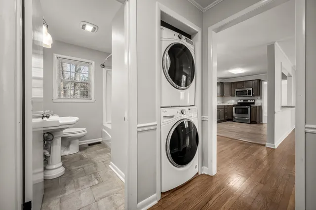 a view of a hallway with washer and dryer