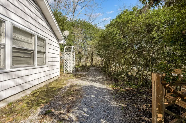 a view of a house with a tree