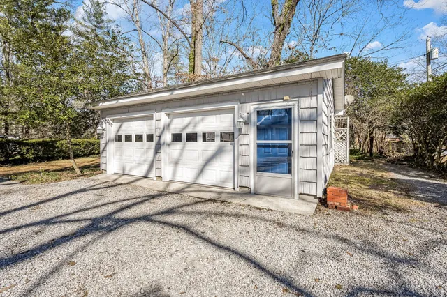 a view of a house with a snow on the road