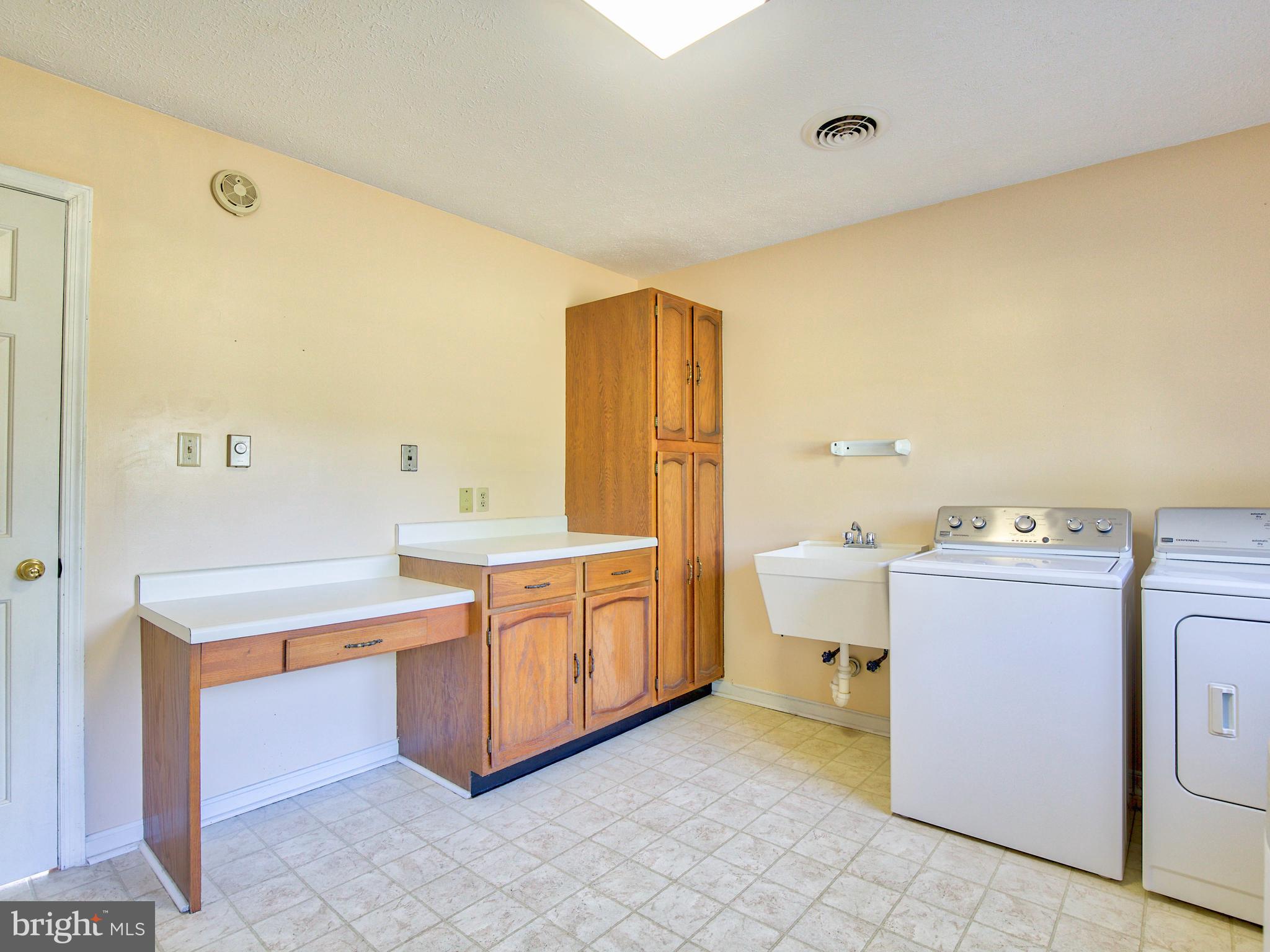 164 Hanging Tree Road Winchester, VA 22603 - Photo 26 of 43 Great workspace and storage in the Laundry Room
