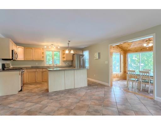 49 Island Road Groton, MA 01450 - Photo 3 of 26 a kitchen with granite countertop a stove a sink and a refrigerator