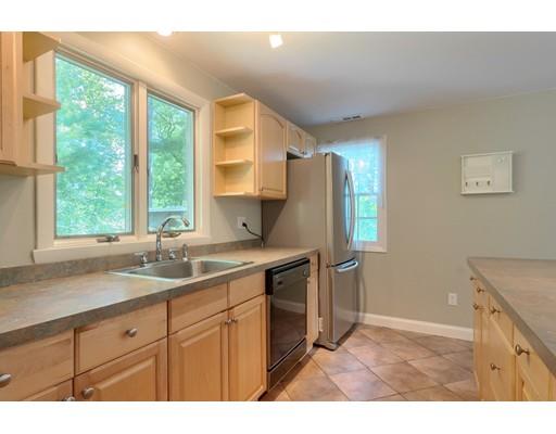 49 Island Road Groton, MA 01450 - Photo 4 of 26 a kitchen with a sink cabinets stainless steel appliances and a large window
