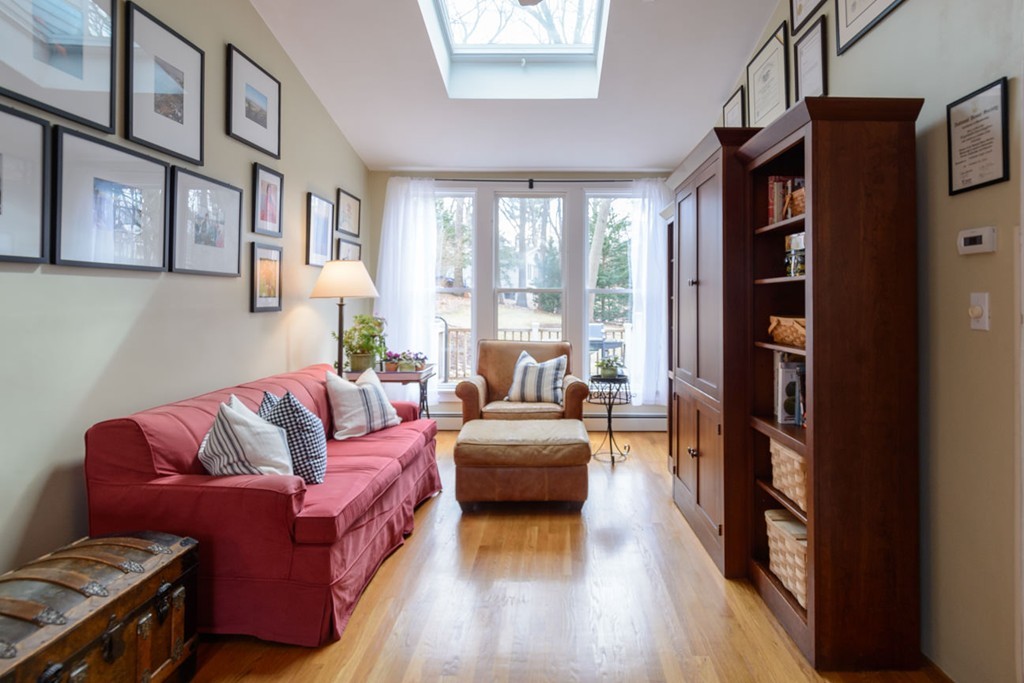 280 Walnut Street Wellesley, MA 02481 - Photo 7 of 13 a living room with furniture or couch and a bookshelf